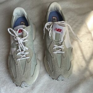 New Balance Men's Athletic Sneakers in Light Gray and White with Red Logo